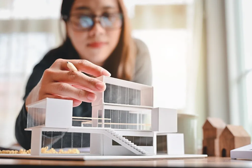 town planner in casey arranging the mini building